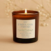 Candle in a brown jar with a personalized label on a beige background