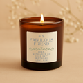 Candle in a brown jar with a personalized label on a beige background