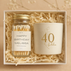 Gift set with a jar of matches and a candle in a box with shredded paper