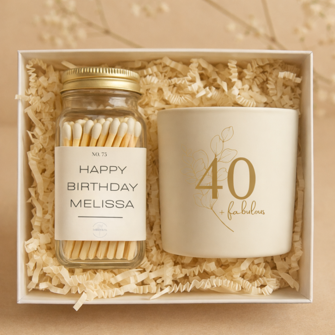 Gift set with a jar of matches and a candle in a box with shredded paper