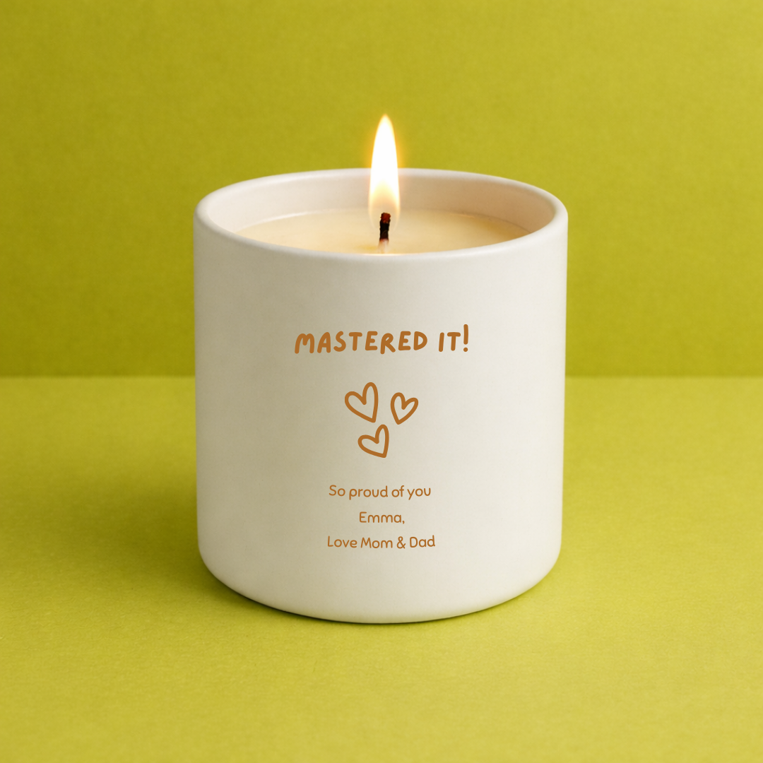 Candle in a white container with text on a green background